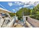 Waterfront boat dock featuring seating and lush tropical foliage at 507 Buena Vista Dr, Nokomis, FL 34275