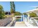 Boat dock with boat lift, bench, and waterfront views at 507 Buena Vista Dr, Nokomis, FL 34275