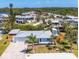 Waterfront home featuring a new roof, lush landscaping and an expansive driveway at 507 Buena Vista Dr, Nokomis, FL 34275
