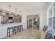 Contemporary kitchen featuring a bar area overlooking an adjacent living space at 507 Buena Vista Dr, Nokomis, FL 34275