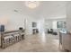 Comfortable living area with a TV, bar table, and tile flooring at 507 Buena Vista Dr, Nokomis, FL 34275