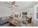 Open living space with tile floors, gray sofa, and comfortable seating at 507 Buena Vista Dr, Nokomis, FL 34275