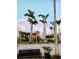 Charming commercial building featuring a stylish design with palm trees and well-maintained landscaping at 510 Airport E Ave # 2C, Venice, FL 34285