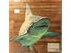 Detail of a wall mural featuring a shark painted on wooden planks as a 3-D chalk festival promotion at 510 Airport E Ave # 2C, Venice, FL 34285
