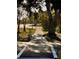 Sidewalk with shade trees and easy access at 510 Airport E Ave # 2C, Venice, FL 34285