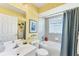 Bright bathroom offers tub and shower combo, neutral color palette, and modern fixtures at 5189 Pine Shadow Ln, North Port, FL 34287