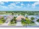 Charming home with lush landscaping and serene water views in a lovely neighborhood at 5189 Pine Shadow Ln, North Port, FL 34287