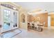 Inviting foyer with tile flooring that leads into dining room at 5189 Pine Shadow Ln, North Port, FL 34287