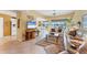 Open living area with neutral tones and views of the outdoor scenery at 5189 Pine Shadow Ln, North Port, FL 34287