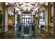 An elegant building lobby with stairs, tasteful decor, and large windows at 5189 Pine Shadow Ln, North Port, FL 34287