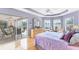 Main bedroom with water views and slider access to the outdoor living area at 5189 Pine Shadow Ln, North Port, FL 34287