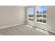 Carpeted bedroom offers bright natural light and views of the outdoors at 5255 Layton Dr, Venice, FL 34293