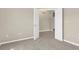 This bedroom features neutral walls, light carpet, and open double doors at 5255 Layton Dr, Venice, FL 34293