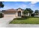 Charming one story home with a well maintained lawn and a two car garage at 5255 Layton Dr, Venice, FL 34293