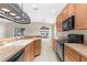 Bright kitchen offering a breakfast bar, stainless steel appliances, and views to the outdoors at 5255 Layton Dr, Venice, FL 34293
