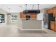 Modern kitchen featuring stainless steel appliances, breakfast bar, and ample natural light at 5255 Layton Dr, Venice, FL 34293