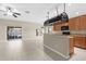 Open kitchen with stainless steel appliances, breakfast bar, and adjacent living space at 5255 Layton Dr, Venice, FL 34293