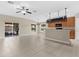 Open floor plan features a breakfast bar, access to screened in patio, and tile flooring at 5255 Layton Dr, Venice, FL 34293