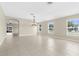 Spacious living room with tile floors, neutral walls, recessed lighting, and plenty of natural light at 5255 Layton Dr, Venice, FL 34293