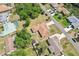 An aerial view of a single-Gathering home in a neighborhood with mature trees, landscaping, and a private backyard at 5417 Maccaughey Dr, North Port, FL 34287