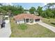 Aerial view of home with two-car garage and lush lawns at 5417 Maccaughey Dr, North Port, FL 34287