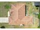 Birds-eye view showcasing the roof shape and layout, including surrounding yard with play set at 5417 Maccaughey Dr, North Port, FL 34287