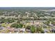 Aerial view of a residential neighborhood with mature trees, lush greenery and waterways at 5417 Maccaughey Dr, North Port, FL 34287