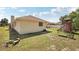 Lush backyard featuring mature landscaping and a playset at 5417 Maccaughey Dr, North Port, FL 34287