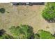 Aerial view of the home's expansive backyard, featuring lush greenery and mature trees at 5417 Maccaughey Dr, North Port, FL 34287