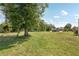Large grass backyard with mature tree coverage at 5417 Maccaughey Dr, North Port, FL 34287