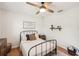 Bright bedroom with a ceiling fan, warm decor, and a motivational art piece at 5417 Maccaughey Dr, North Port, FL 34287