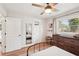 Neat bedroom with natural light, a ceiling fan, and a built-in basketball hoop on the door at 5417 Maccaughey Dr, North Port, FL 34287