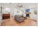 Bright living room with laminate floors, fireplace, and a comfortable seating area at 5417 Maccaughey Dr, North Port, FL 34287