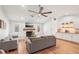 Spacious living room with laminate floors, fireplace, and plenty of natural light at 5417 Maccaughey Dr, North Port, FL 34287