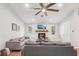 Comfortable living room with a stone fireplace, laminate floors, and ample seating at 5417 Maccaughey Dr, North Port, FL 34287