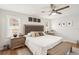 Inviting main bedroom featuring a plush bed, stylish furniture, and a ceiling fan at 5417 Maccaughey Dr, North Port, FL 34287