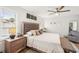 Inviting main bedroom featuring a plush bed, stylish furniture, and a ceiling fan at 5417 Maccaughey Dr, North Port, FL 34287