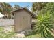 Storage shed adjacent to privacy fence at 5417 Maccaughey Dr, North Port, FL 34287