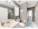 Well-lit bathroom featuring a single sink vanity and framed mirror at 5766 Stone Pointe Dr, Sarasota, FL 34233