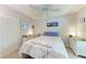 Comfortable bedroom featuring neutral walls, plush bedding, and natural light at 5766 Stone Pointe Dr, Sarasota, FL 34233