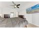 Spacious bedroom featuring neutral walls, ceiling fan, television and tiled floors at 5766 Stone Pointe Dr, Sarasota, FL 34233