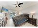 Bedroom featuring a large bed, ceiling fan, and a view of the pool at 5766 Stone Pointe Dr, Sarasota, FL 34233