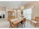 Dining room featuring a wood table, china cabinet, chandelier, and natural light at 5766 Stone Pointe Dr, Sarasota, FL 34233