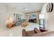 Spacious living room featuring tile floors, neutral colors, and a comfortable seating area at 5766 Stone Pointe Dr, Sarasota, FL 34233