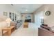 Bright living room with tile floors, neutral colors, and sliding doors to the outside at 5766 Stone Pointe Dr, Sarasota, FL 34233