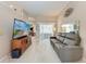 Comfortable living room featuring wood floors, modern furniture, and neutral tones at 5766 Stone Pointe Dr, Sarasota, FL 34233