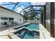 Enclosed pool area with refreshing pool, spa, and ample lounge space at 5766 Stone Pointe Dr, Sarasota, FL 34233