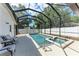 Enclosed pool area with refreshing pool, spa, and ample lounge space at 5766 Stone Pointe Dr, Sarasota, FL 34233