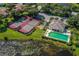Overhead view of tennis courts, pool, and clubhouse amenities at 615 May Apple Way, Venice, FL 34293