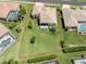 Expansive backyard and lush green space is surrounded by a red property outline at 615 May Apple Way, Venice, FL 34293